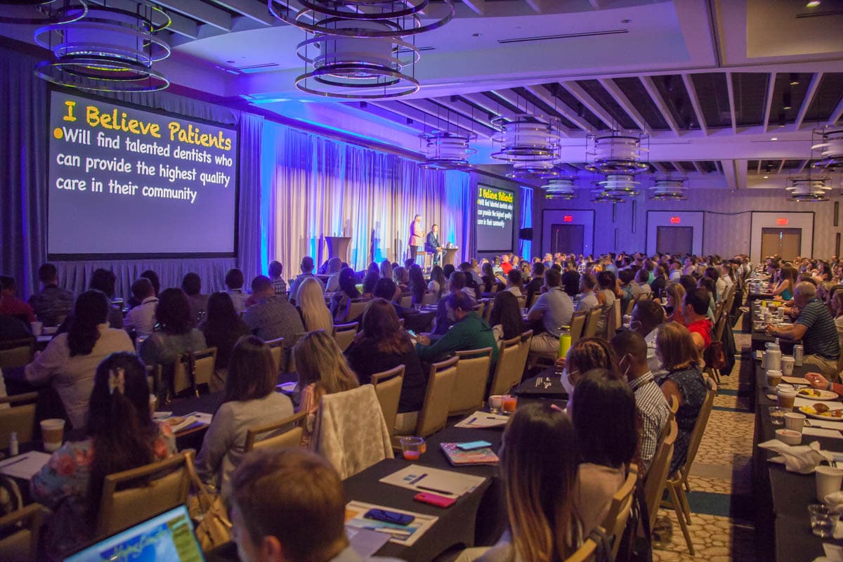 A packed ballroom of dentists at a Strupp & Brumm continuing education seminar