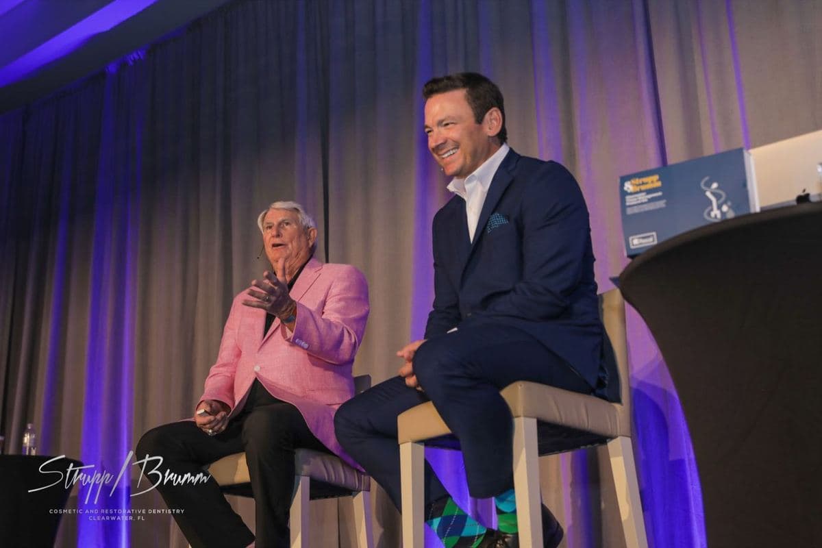 Dr. Strupp and Dr. Brumm teaching together on stage at a Simplifying Complex seminar